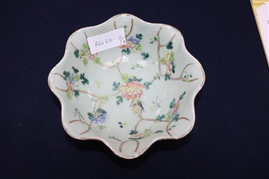 A Chinese celadon glazed dish, a Jun type tripod dish and a famille rose bowl and cover